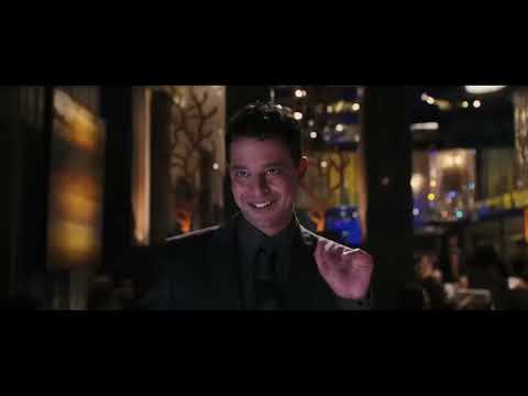 Date Night trailer still: Phil & Claire framed by blue police lights