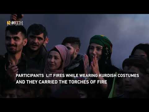 Residents of the city of Syria’s Amuda celebrate Newroz