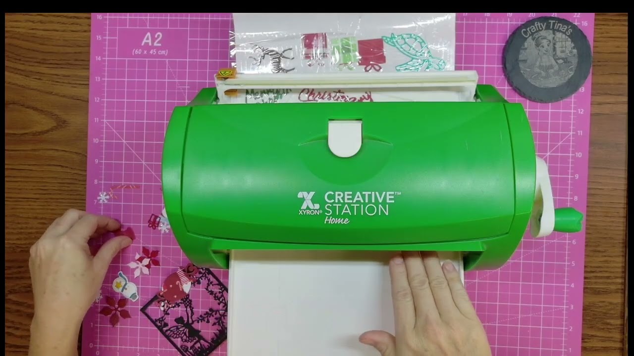 Xyron sticker maker. What is it and how does it work. Adding adhesive to die cuts.
