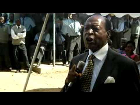 Oluoch Kanindo addressing parents during price giving day in Wi Obiero Secondary School; he started  the School when he was Ass  Minister of Education