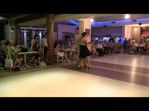  Cesira Miceli  and  Chenkuo Che Sierra  are  dancing  to  the  milonga  "  La Luciernaga  "  by  Color Tango  at  Sunny Tango Festival  in  2012