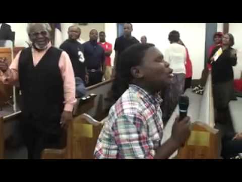Boy singing with the anointing