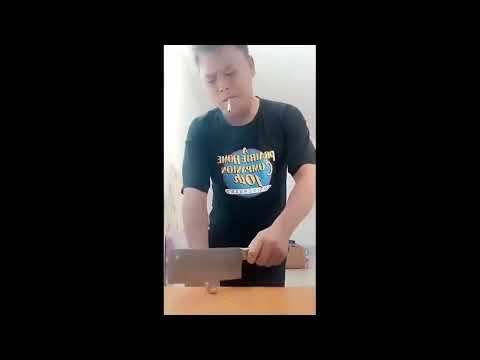 Crazy chinese man chops his finger