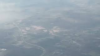 Stunning Aerial View: Buffalo to New York Plane Journey Above the Clouds