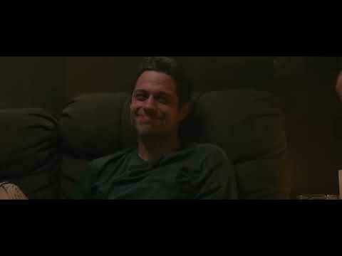 Trailer shot: Scott on the Staten Island Ferry deck at golden hour; a small synth-guitar cue would fit under it
