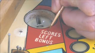 Touching up the paint on a Williams Grand Prix Electromechanical Pinball Machine Playfield! -2