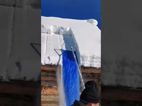 Shoveling snow off of roof