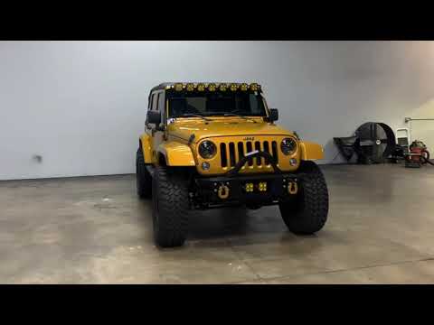 Sold: 2014 Jeep Wrangler Unlimited Sahara