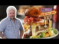 Guy Fieri Eats A Burger Topped With Hot Cheese Snacks Diners Drive Ins And Dives Food Network