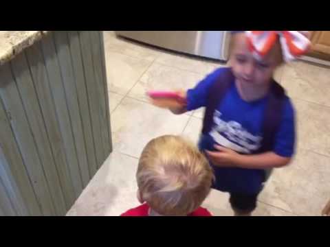 Kimbrey combs her brothers hair