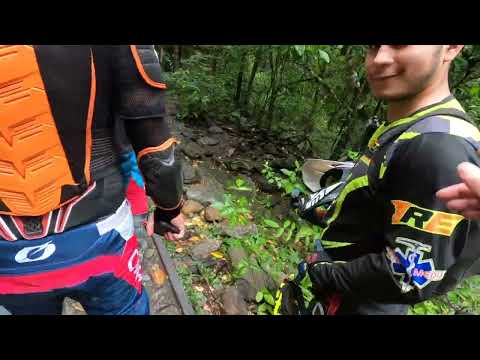 Riding an abandoned train track alongside the Rio Negro in Colombia