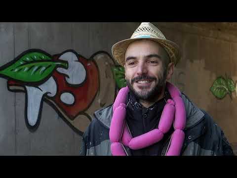 Italian artist 'Cibo' covers racist graffiti with food murals