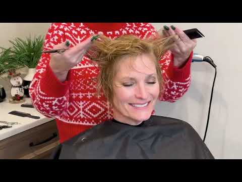 Wavy stacked haircut for women over 50 from YouTube