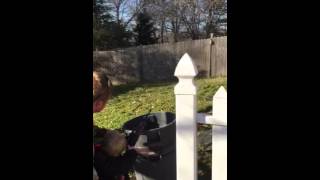 Daddy teaching son to shoot a BB gun