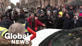 "They turn us into mutants:" Anti-vaccine protesters block traffic in Kyiv, Ukraine