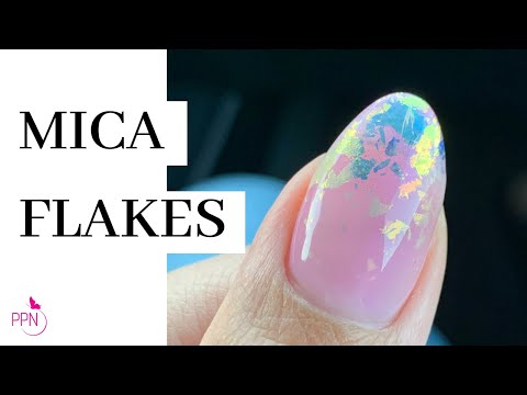 Part of a video titled How To Mica Flakes Nail Art On Structure Overlay - YouTube
