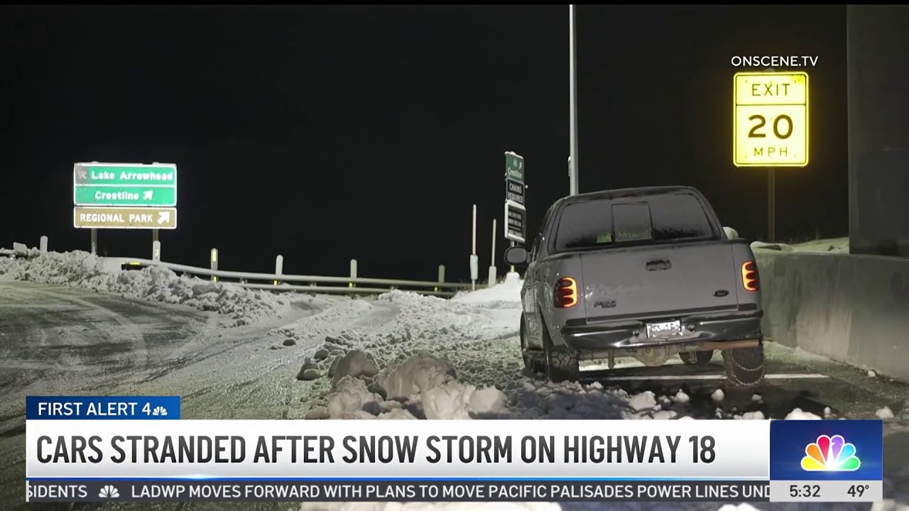 Cars stranded after snow storm on Highway 18