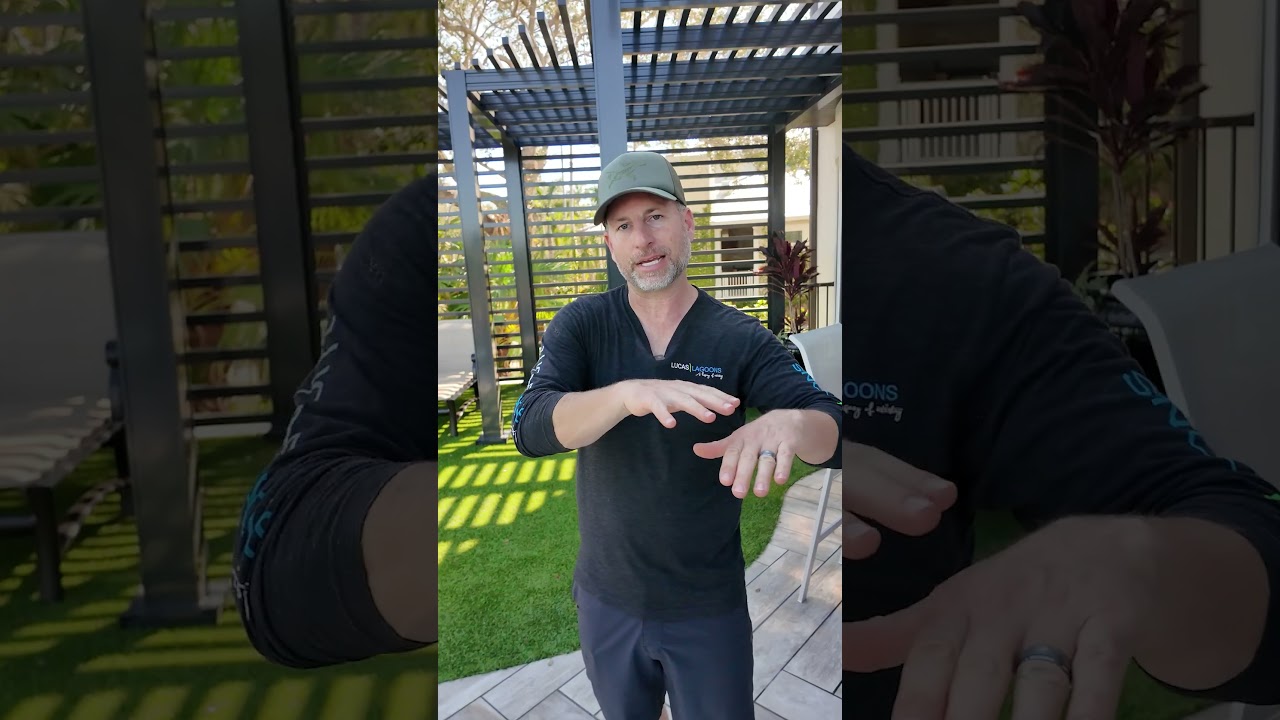 Disguised lap pool with a freeform shape that follows the minimum setbacks from the water