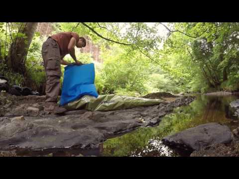 Using an inflation bag to blow up a packraft. IRON RAFT