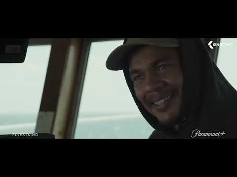Finestkind trailer frame: late-night drive on the docks, sodium haze on wet asphalt