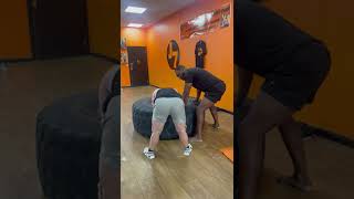 Gym owner does one on one training with a very dedicated young man with Down Syndrome!
