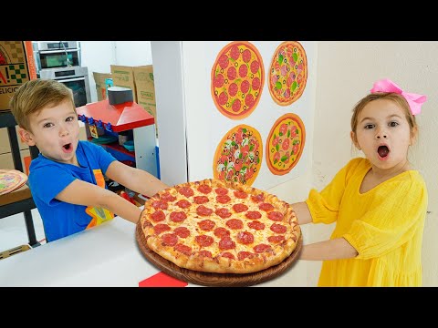 Kids learn how to cook pizza and help each other