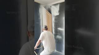 Cabinet doors being sprayed by Ryan