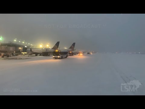 12-29-2020 Chicago, IL - Snowed-In Airport Runway - Flight Cancellations - Slushy Roads