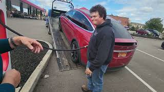 Tesla model X with dead battery stuck on flatbed at supercharger