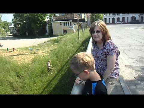 Young Man jumping off bridge in Kingfield Maine