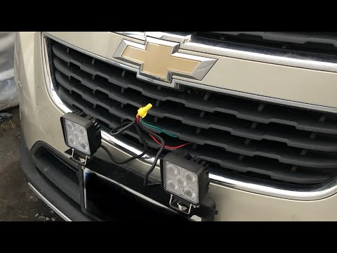LED fog lights and license plate mounting bracket