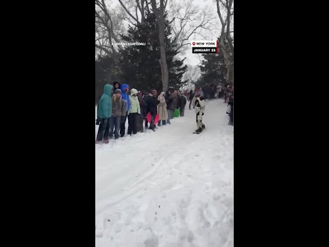 Shaun White jumps over people in snowy NYC