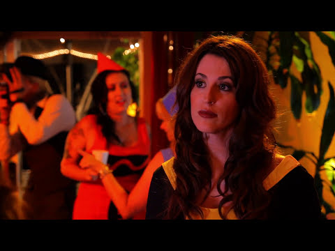 Halloween Party (2012) trailer still: crowded living-room party with orange string lights