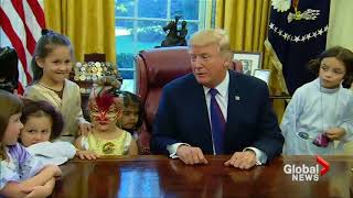 Trump welcomes press corps kids trick-or-treating in Oval Office