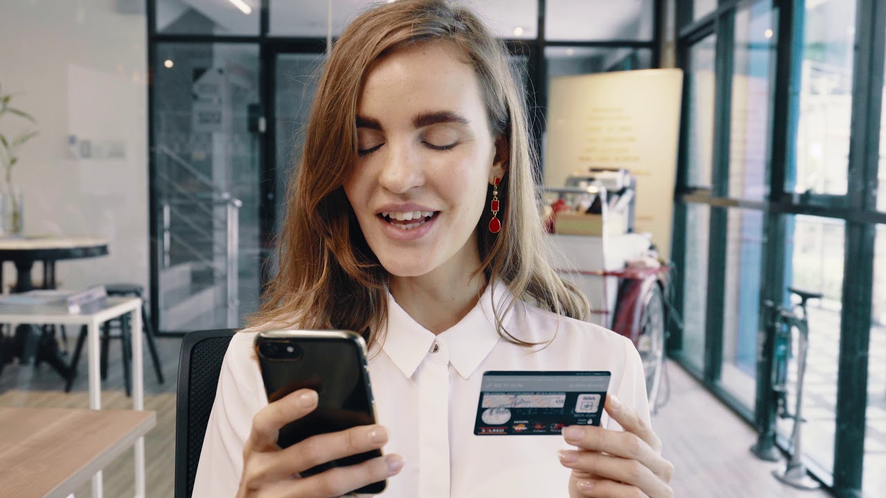 businesswoman online shopping using credit card an -video background for WebSite