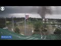 Tornado uproots trees as it rips through city in Kansas