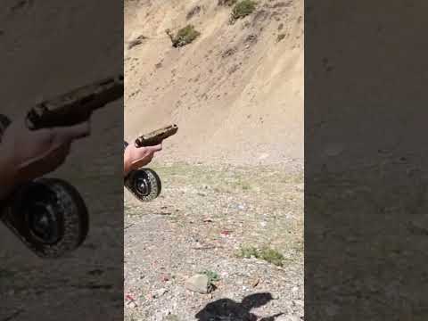 Full auto Glock with 100 round drum mag