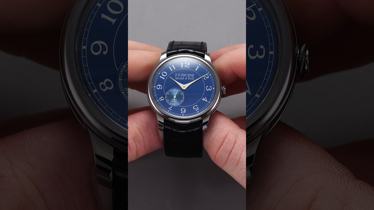 Teddy Baldassarre presenting three blue-dial watches (unspecified brands and models)