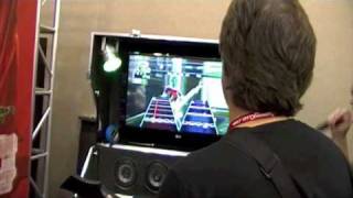 Stan Bush fails at playing his song&quot;The Touch&quot; on Guitar Hero at Botcon 2009