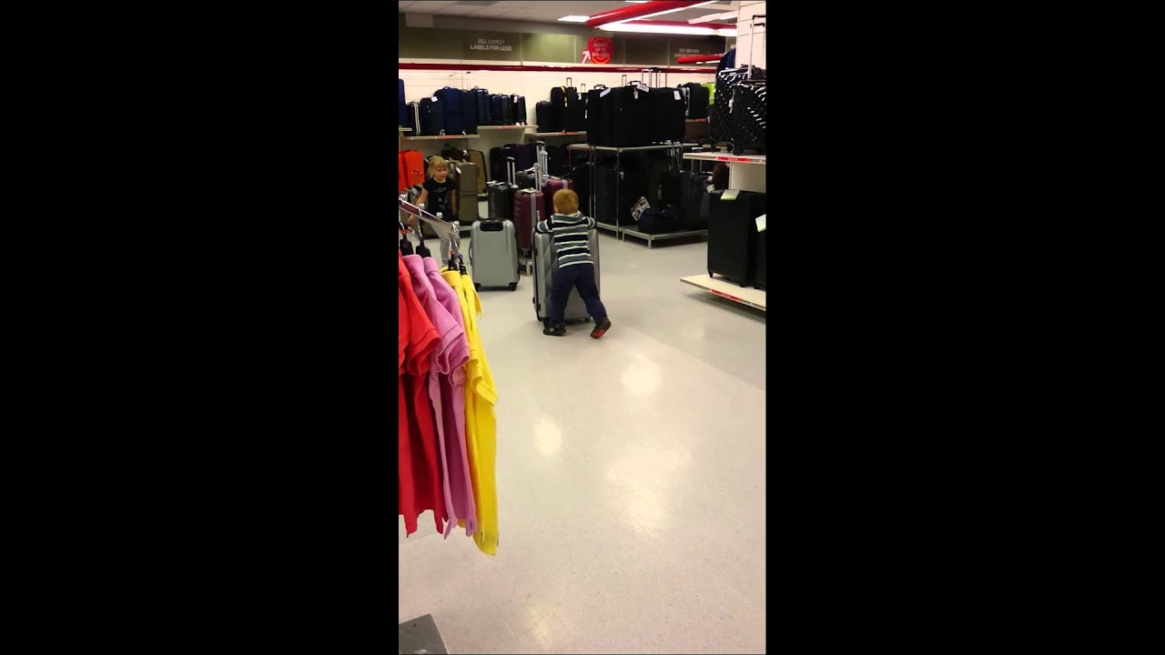 two kids using suitcases as a toys in TK-Maxx (part 2)