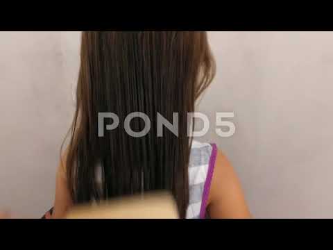 The Girl Is Combing Her Hair