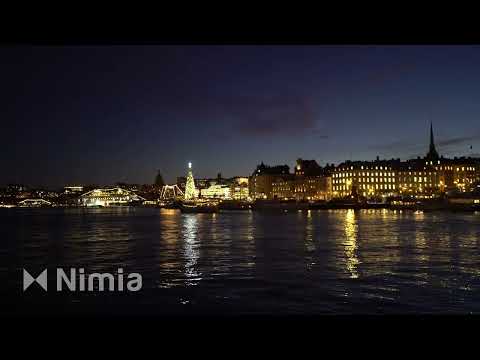 skeppsbron in stockholm by night   illuminated city at christmas time   city lights