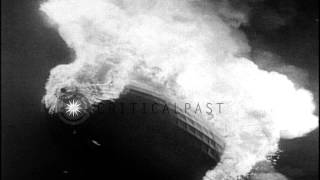 Final flight of the airship Hindenburg, then it bursts into flames when landing HD Stock Footage