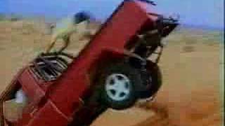 Truck in desert with idiot on back