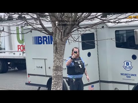 VIKING LOOKING BRINKS SECURITY GUARD ACTS AS IF HES NEVER SEEN A CAMERA BEFORE!!!