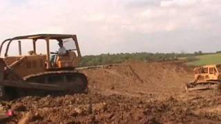 D6C and D7G Caterpillar dozers build farm pond