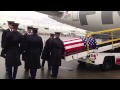 Army honor guard removing a fallen soldier from the ...