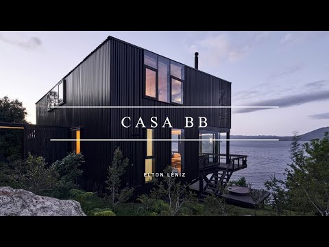 Black Home Design On Stilts Perch On Hillside Overlooking The Lake