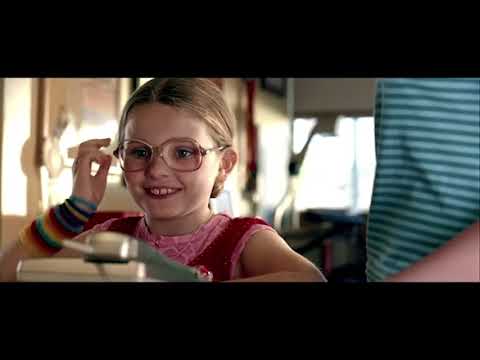 Trailer frame of Olive on stage, spotlighted, as the crowd reacts and the music swells