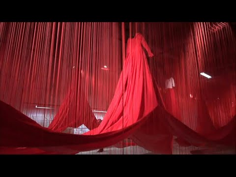 Installation featuring countless red threads opens at Austrian ex-Nazi death camp | AFP
